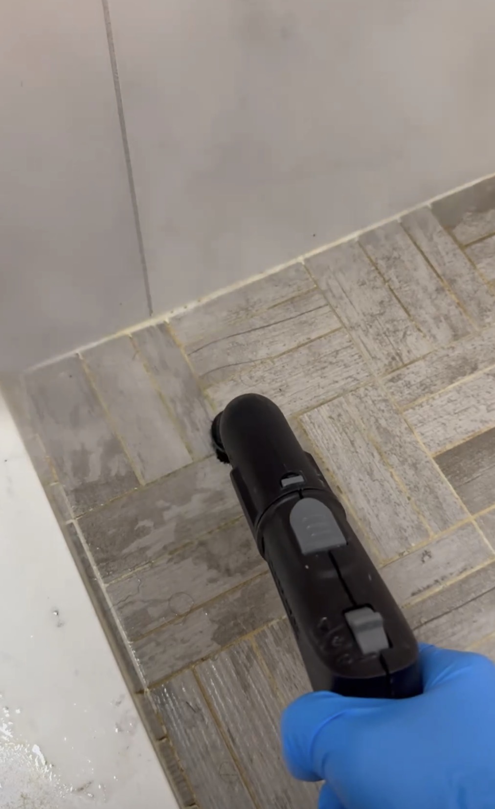 Steam cleaning shower floor and grout